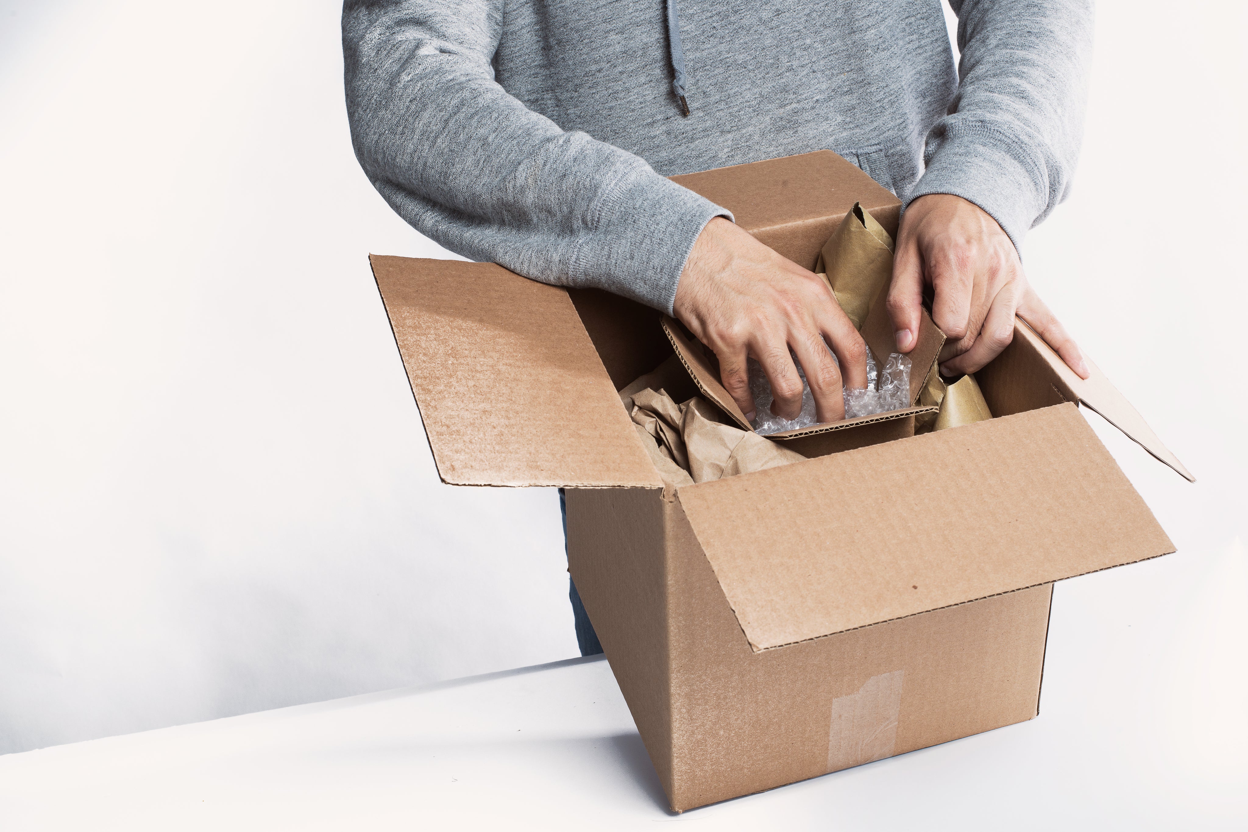 young-man-preparing-a-package-for-fulfillment.jpg